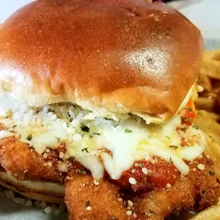 Chicken Parmesan Panini Lightly breaded chicken breast or eggplant, topped with mozzarella and our signature Amici&apos;s marinara