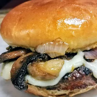 House Burger Fresh half pound burger with grilled mushroom and onion with swiss cheese on a toasted brioche bun