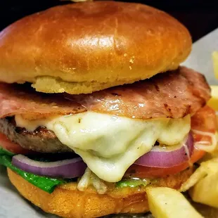 Amici Burger Fresh half pound patty with salami, mozzarella, Italian dressing, lettuce, tomato and onion.