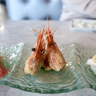 Amaebi with fried shrimp head (served with ponzu sauce) and tako on the right