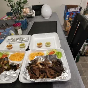 three trays of food on a table