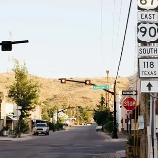 a street scene with a stoplight and signs
