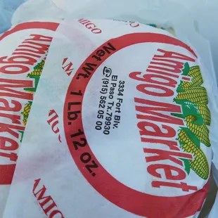 two bags of corn on a table