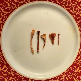 There were 6 bones found in the Pan Con Pollo. One piece broke into tiny shards when bitten, so it was spit into the trash.