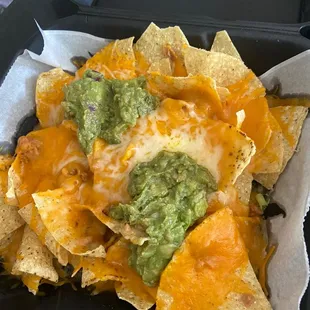 The original nachos containing one item I asked for and one item I didn&apos;t ask for.