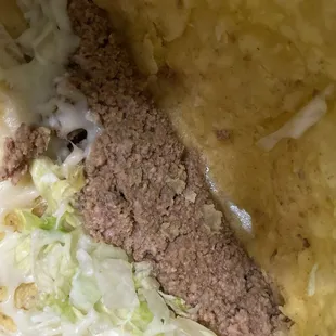 Left over taco. (Didn't order hard shell but that's what we got) that beef definitely has some pink still in it.