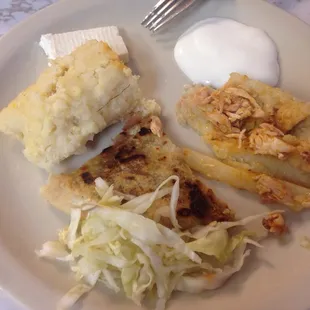 The yelp CMYE spread! sweet corn tamale w/ a side of queso fresco y crema on the top left, clockwise: chicken tamale &amp; bean n cheese pupusa!
