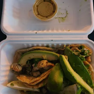 Chicken tacos with added sliced avocado
