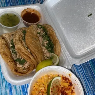 Chicken tacos (without onions) and a cup of Street corn