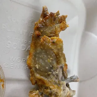 Chicken wing was dark and tasted weird
