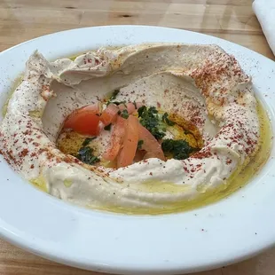 hummus and tomatoes in a bowl