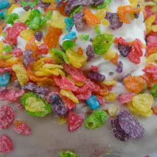 Fruity pebbles donut, close-up.