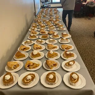 a long table with plates of food
