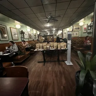 a man sitting at a table in a restaurant