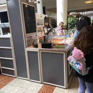 a woman standing in front of a counter