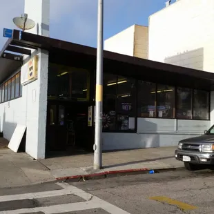 a truck parked in front of a building