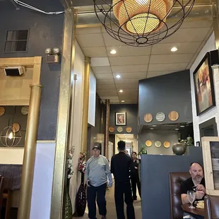 Hallway to the back, dining area, and bar