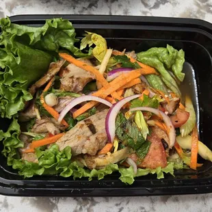 YUM PED YANG Roasted duck shredded and tossed with ginger, scallions, celery, cilantro, and chili paste in a spicy lime juice.