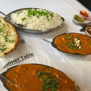 a variety of indian food on a table