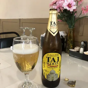 a bottle and a glass of beer