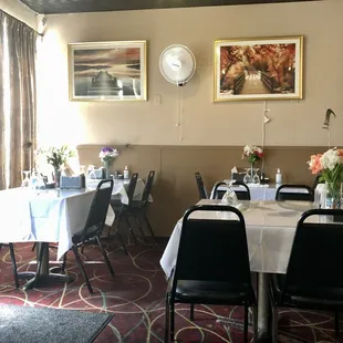 a dining room with tables and chairs