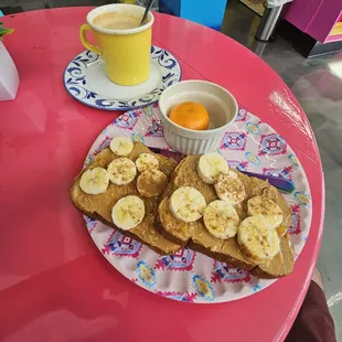 The Sweet: Grain toast with peanut butter spread, banana slices, honey drizzle and cinnamon powder with an orange.   Cafe on leche to drink.