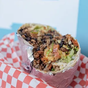 Chupacabra Burrito. 1/2 Carne Asada 1/2 Chorizo.