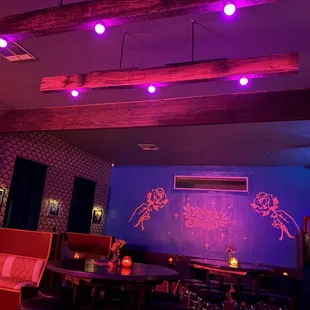 a bar with purple lighting