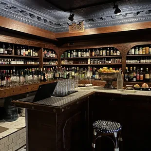 a bar with a laptop on the counter