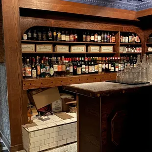 a liquor store with liquor bottles on shelves