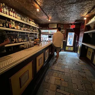 a man standing at a bar