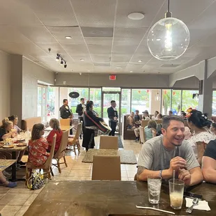 a group of people sitting at a table