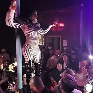 a woman performing on a pole