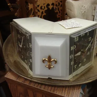 A unique vintage bedside clock - 2 sided with a light in the center - awesome!