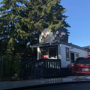  car parked in front of a coffee shop