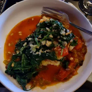 Cod with spinach, pine nuts, fresh garlic and stewed tomatoes