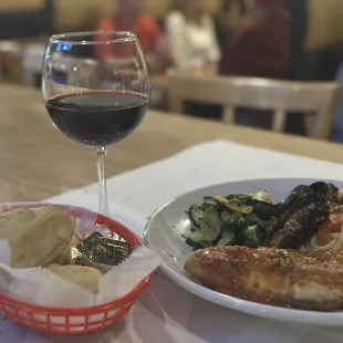 Wine, rolls and pasta.