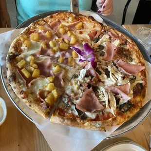 Half Hawaiian Mati pizza and half Chicken, Ham, Mushrooms and Bacon