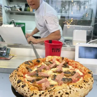 Prosciutto Cotto e Funghi ! One of our most acclaimed Pizzas A great Combination of the finest ingredients  Only in AMORE MÍO