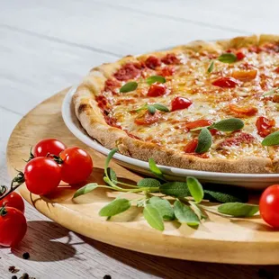 a pizza with tomatoes and basil