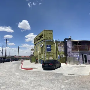 a parking lot with cars parked in front of it