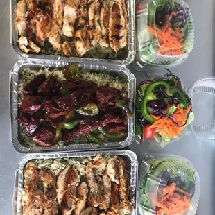 Grilled chicken and steak tips dinner with rice and salad