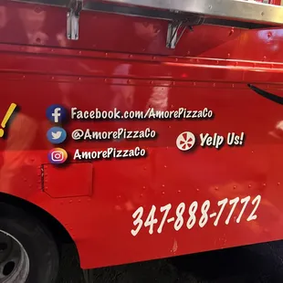 the side of a red food truck