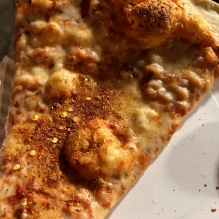 a slice of pizza on a plate