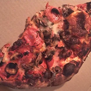 a slice of pizza in a box