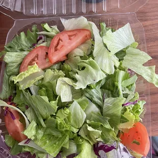 Crappy dinner salad over priced $10 for two slices tomato and lettuce.