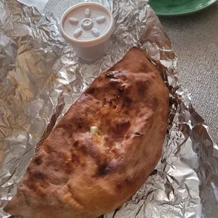 Calzone came with a small cup of marinara.
