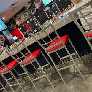 a woman sitting at a bar