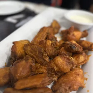 a plate of chicken wings