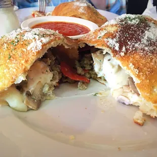 Calzone with sausage, ricotta, pepperoni, and mushrooms. Delicious!